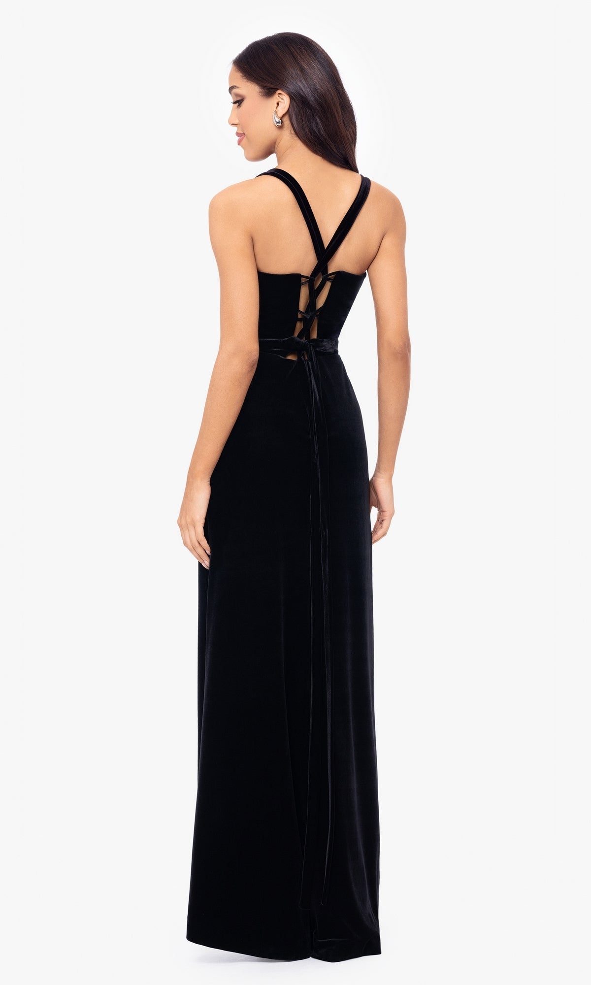 A woman models the Simple Long Velvet Prom Dress (Blondie Nites 5171BN)—a sleeveless black gown with crisscross straps and lace-up back—against a white background.